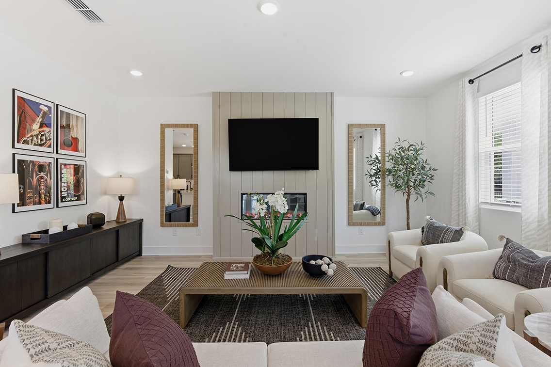 A living room with a tv and couches.