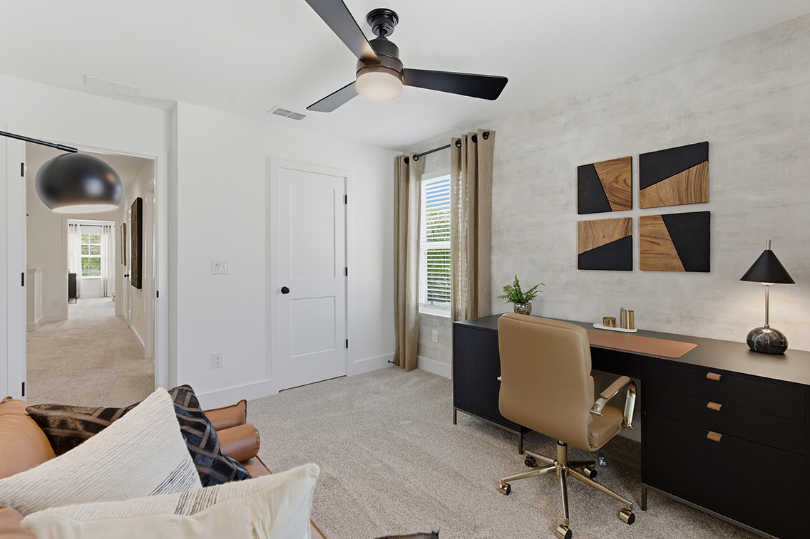 A room with a desk and a chair.