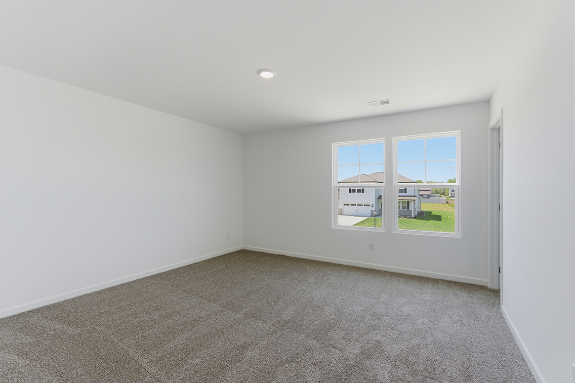 A room with a window and a door.