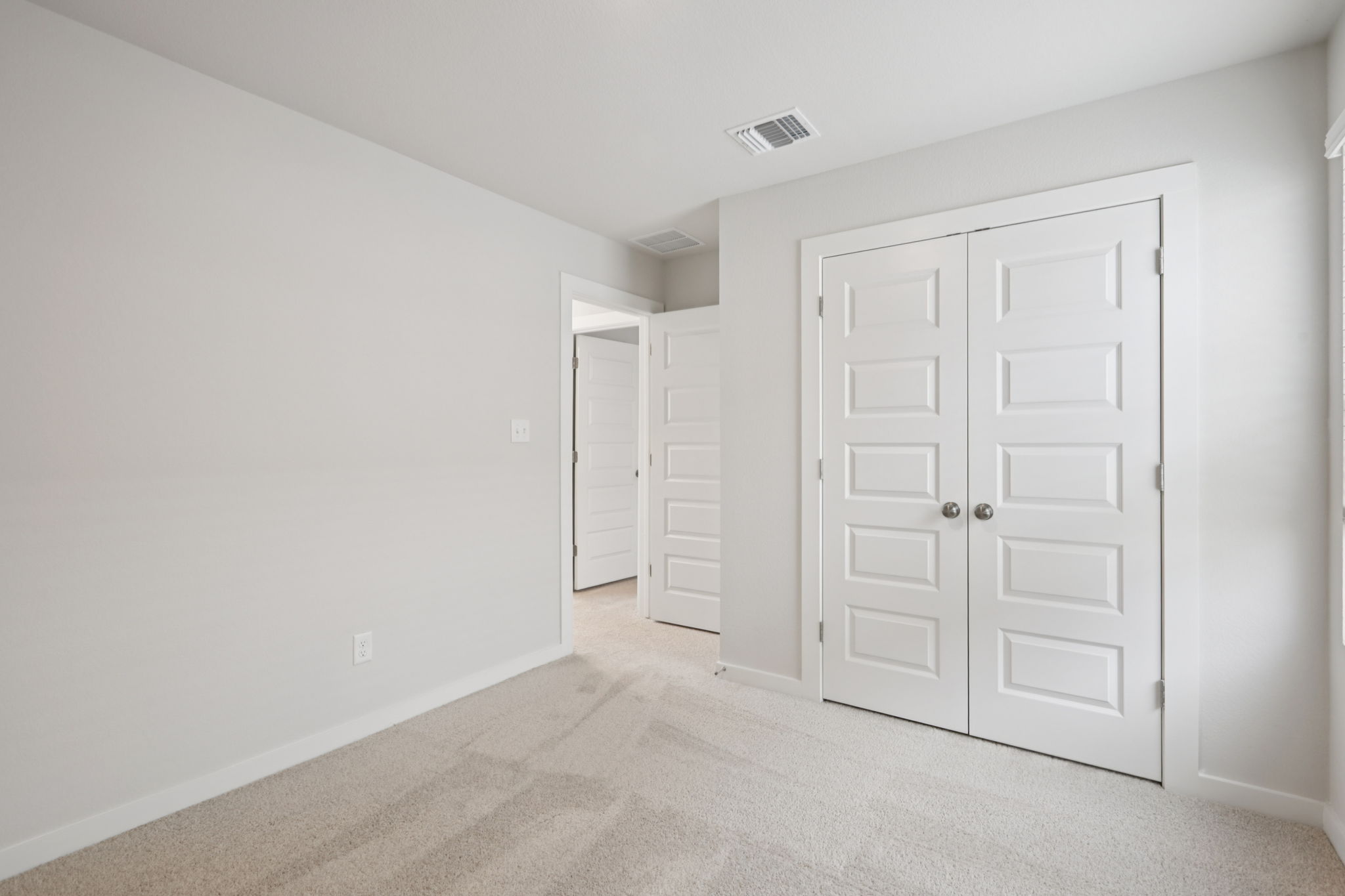 A room with white doors.