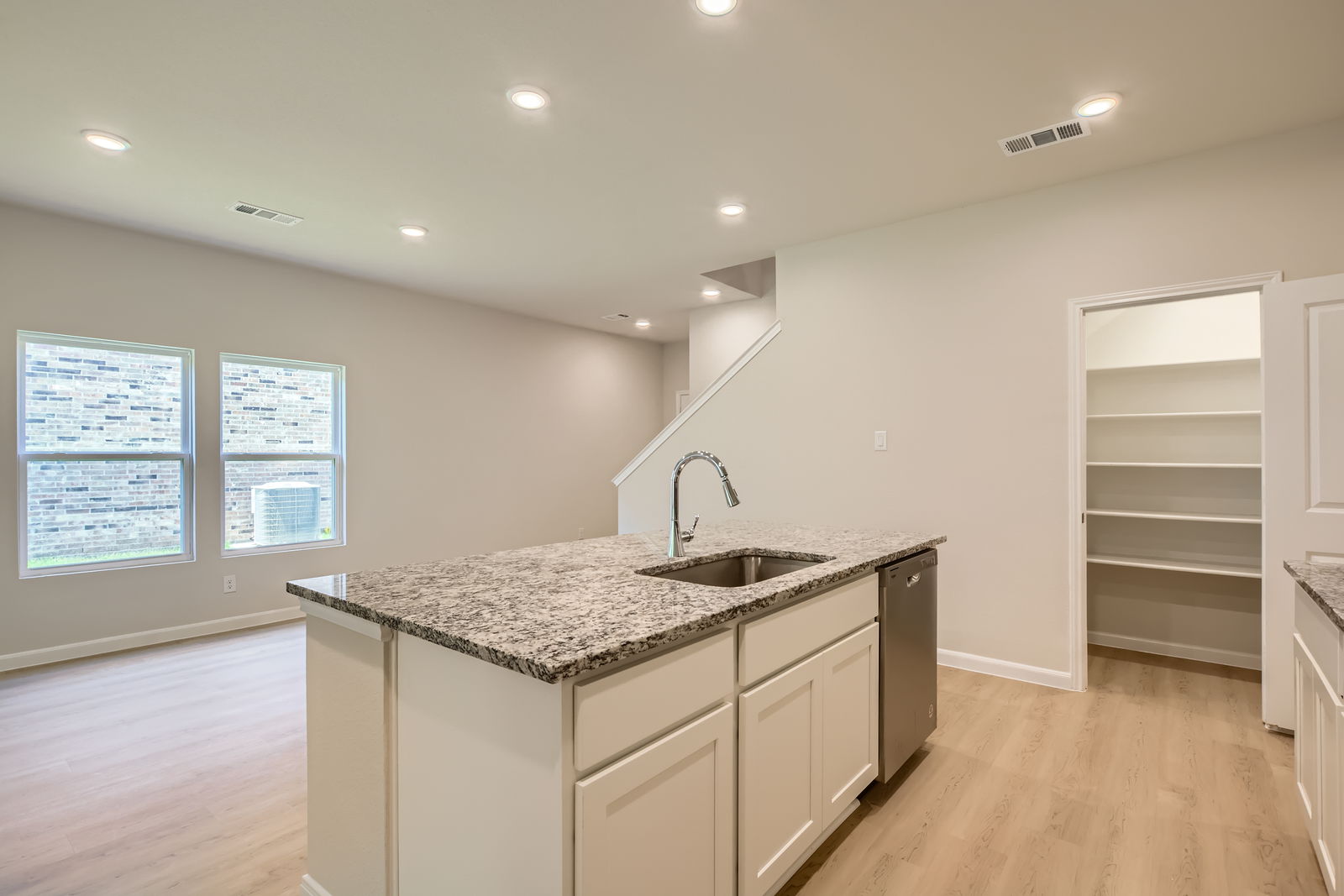 A kitchen with a marble countertop.