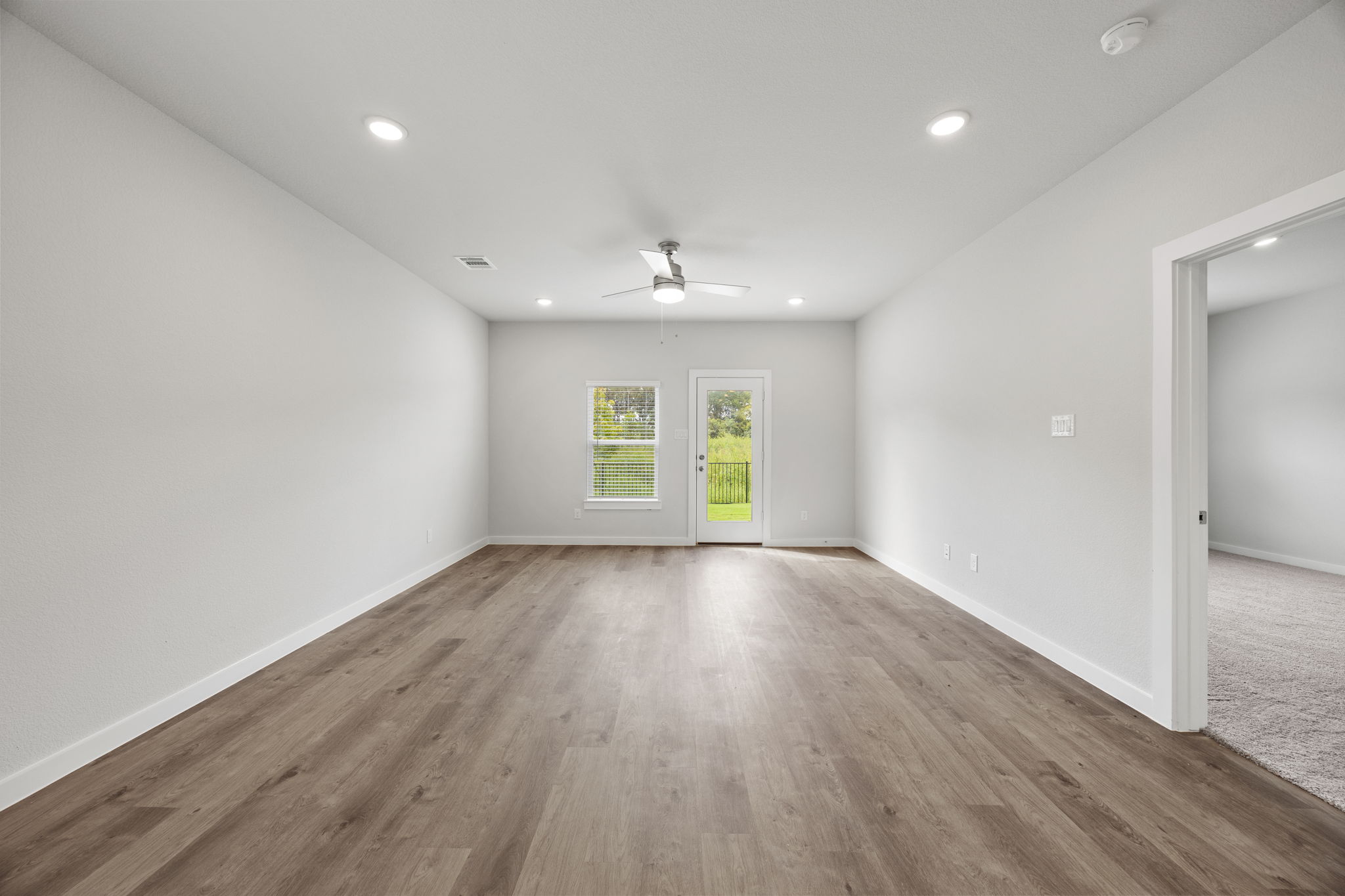 A room with a wood floor and a wood floor.