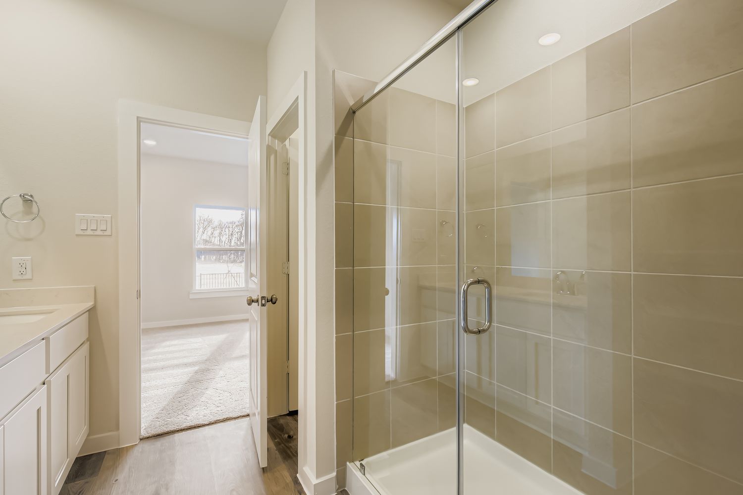 A bathroom with a glass shower.