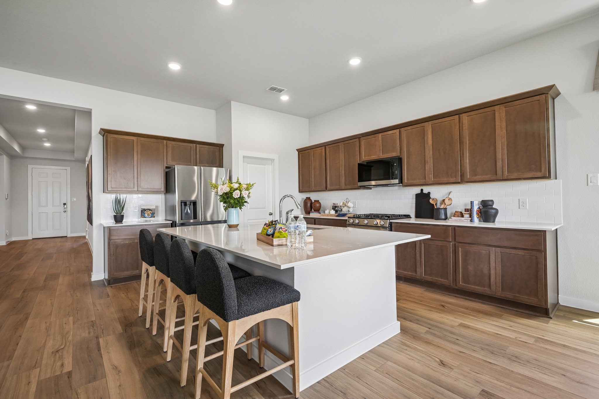 A kitchen with wooden cabinets.