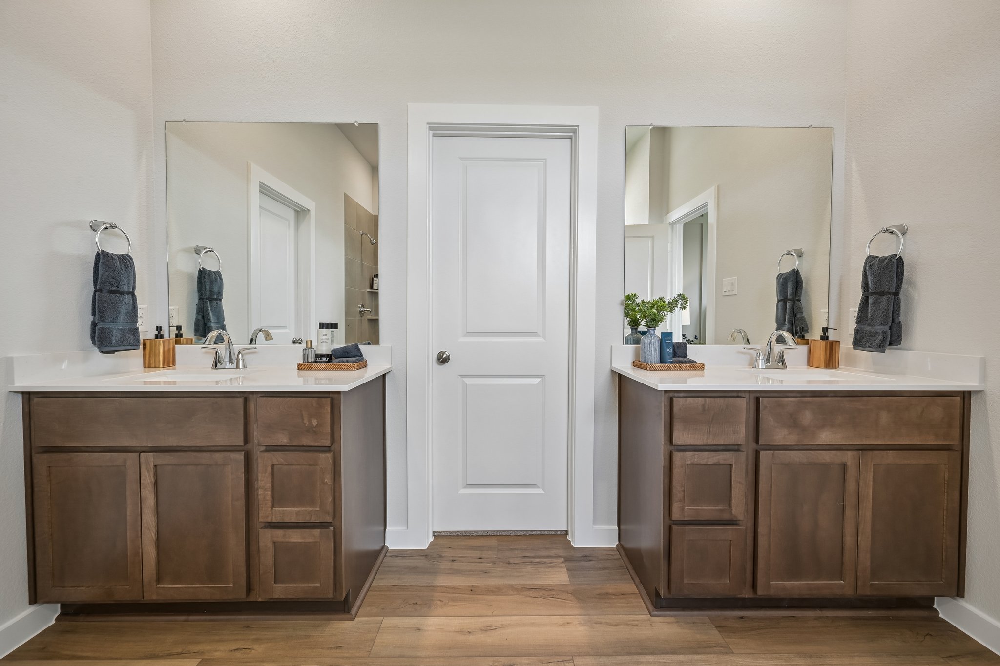 A bathroom with a wood floor.