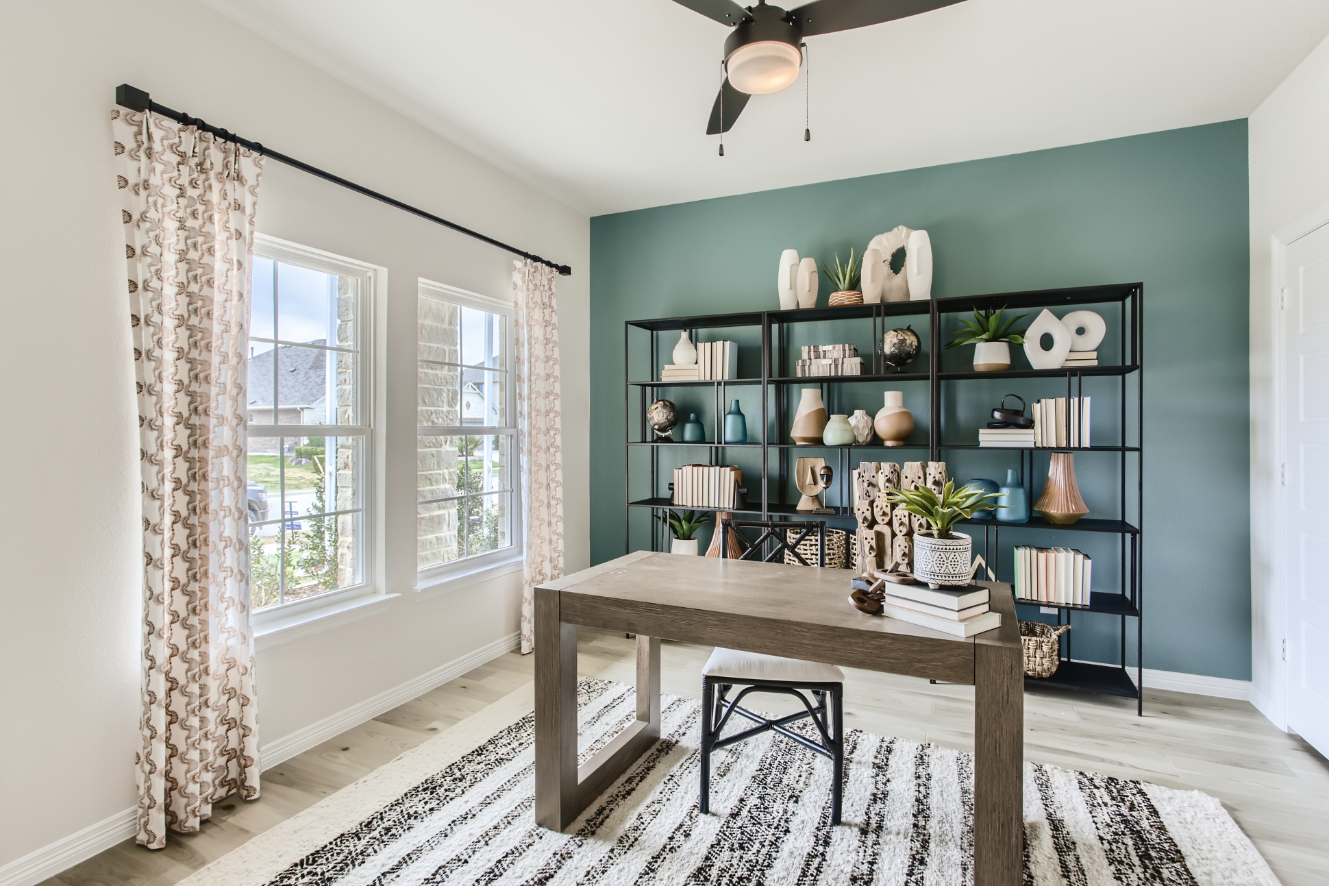 A room with a table and shelves.