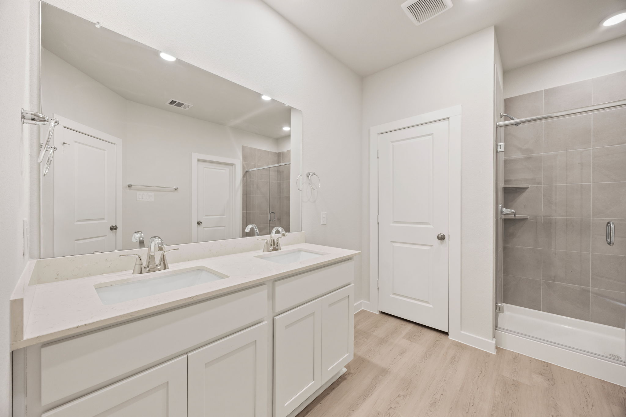 A bathroom with a glass shower.