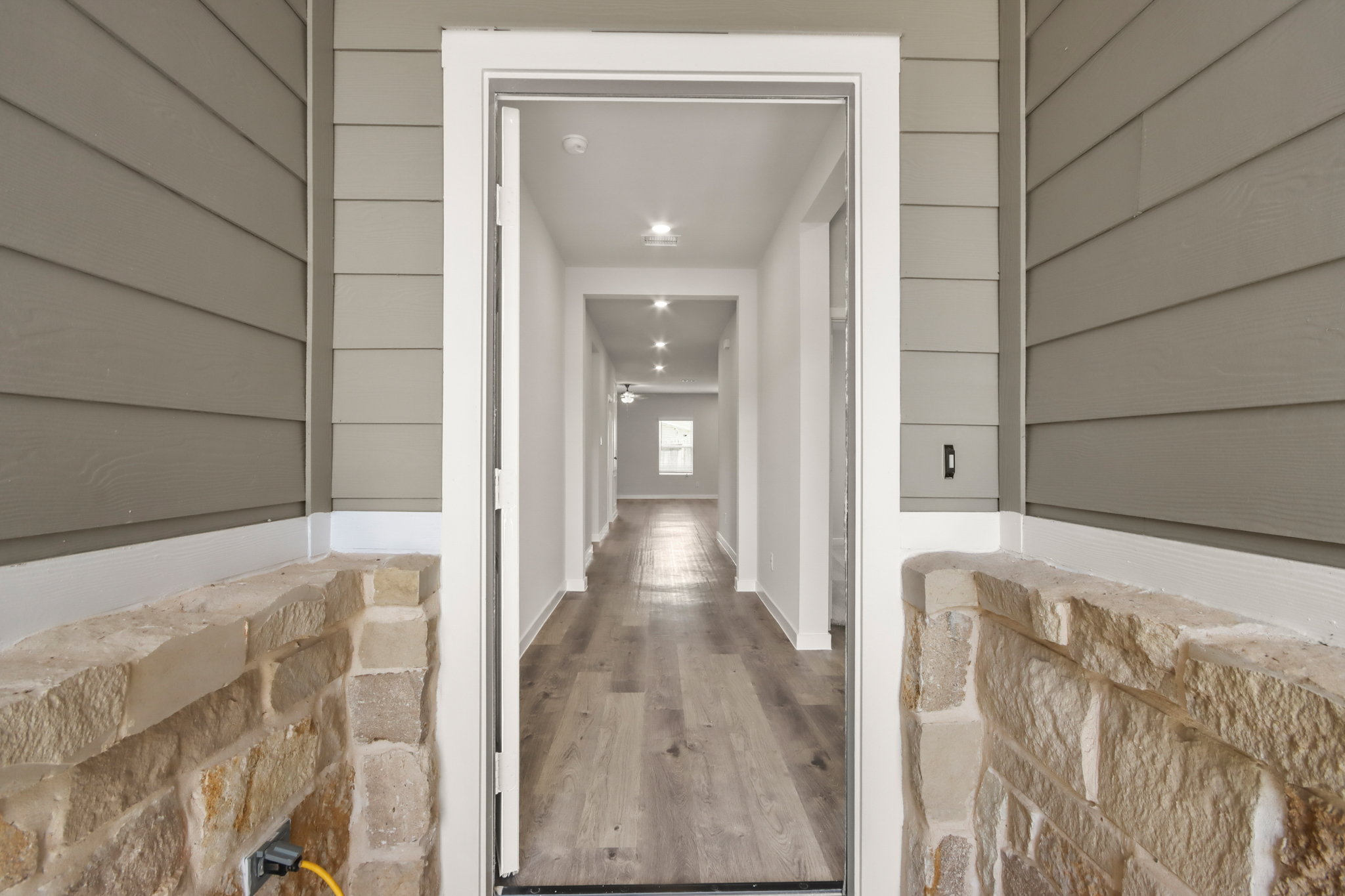 A hallway with brick walls.