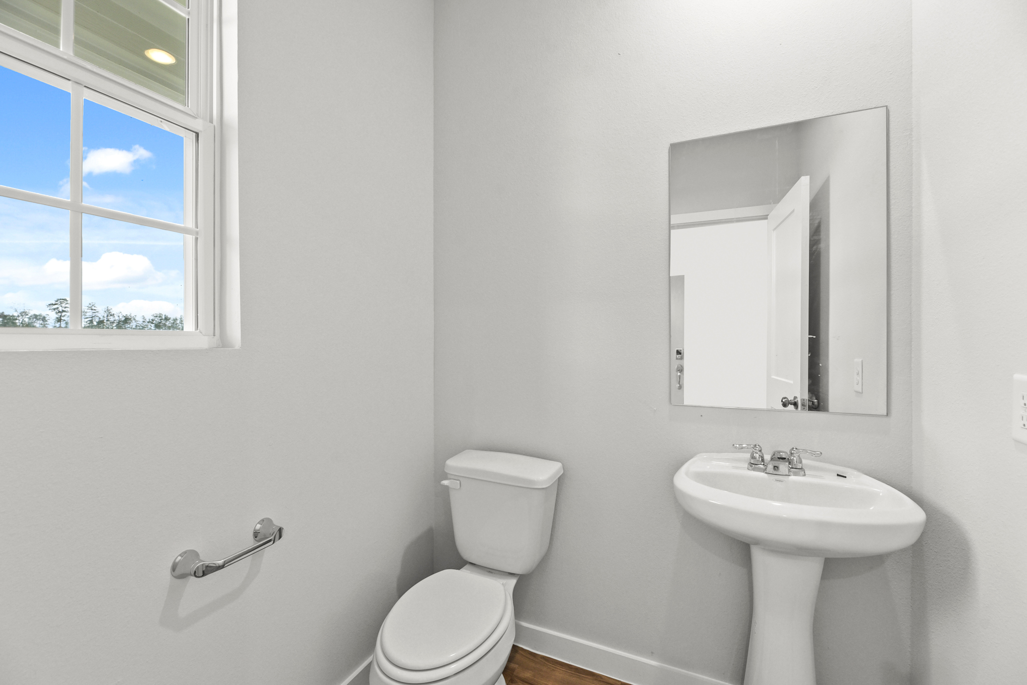 A bathroom with a sink and toilet.