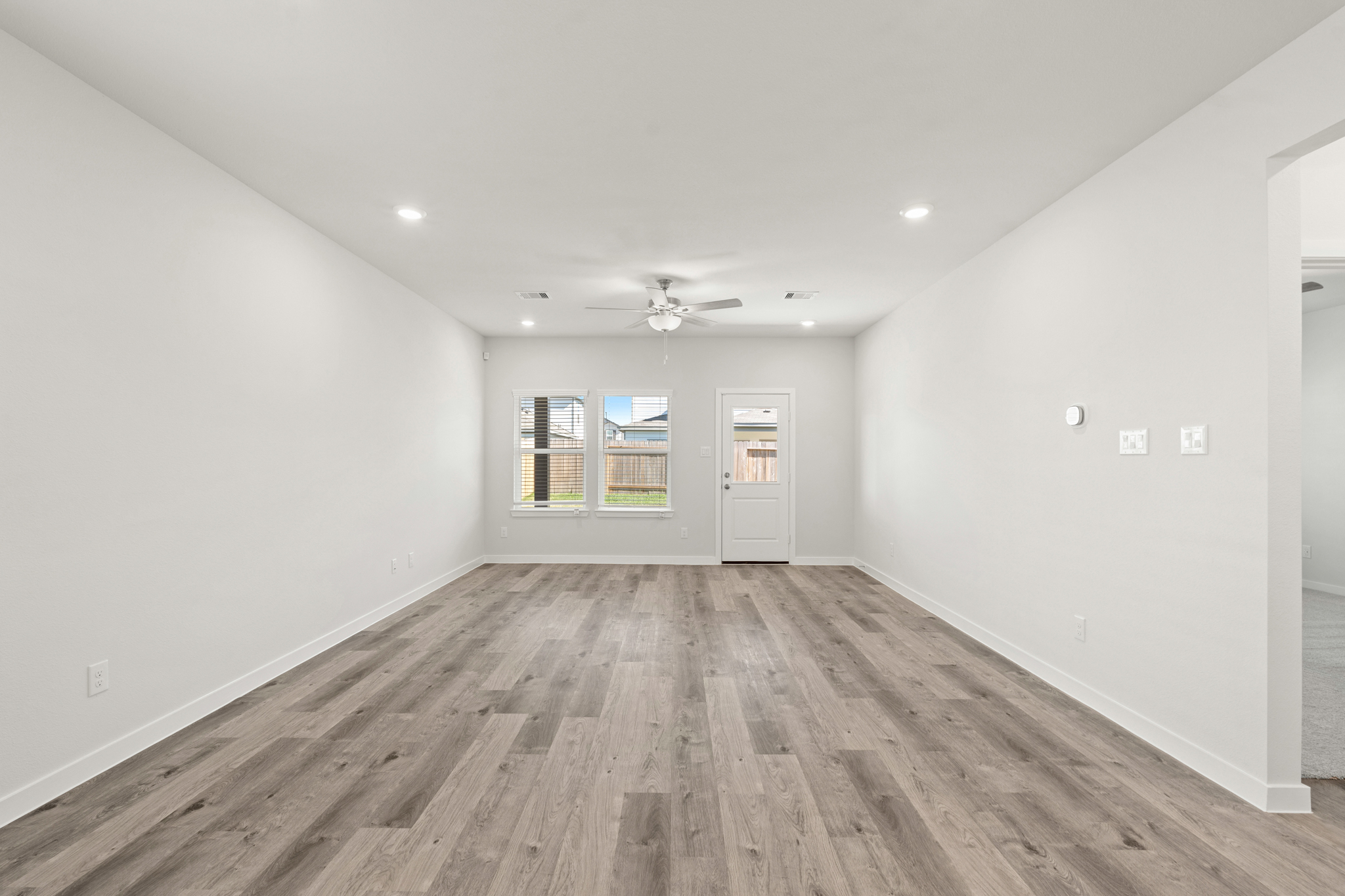 A room with a wood floor and a wood floor.