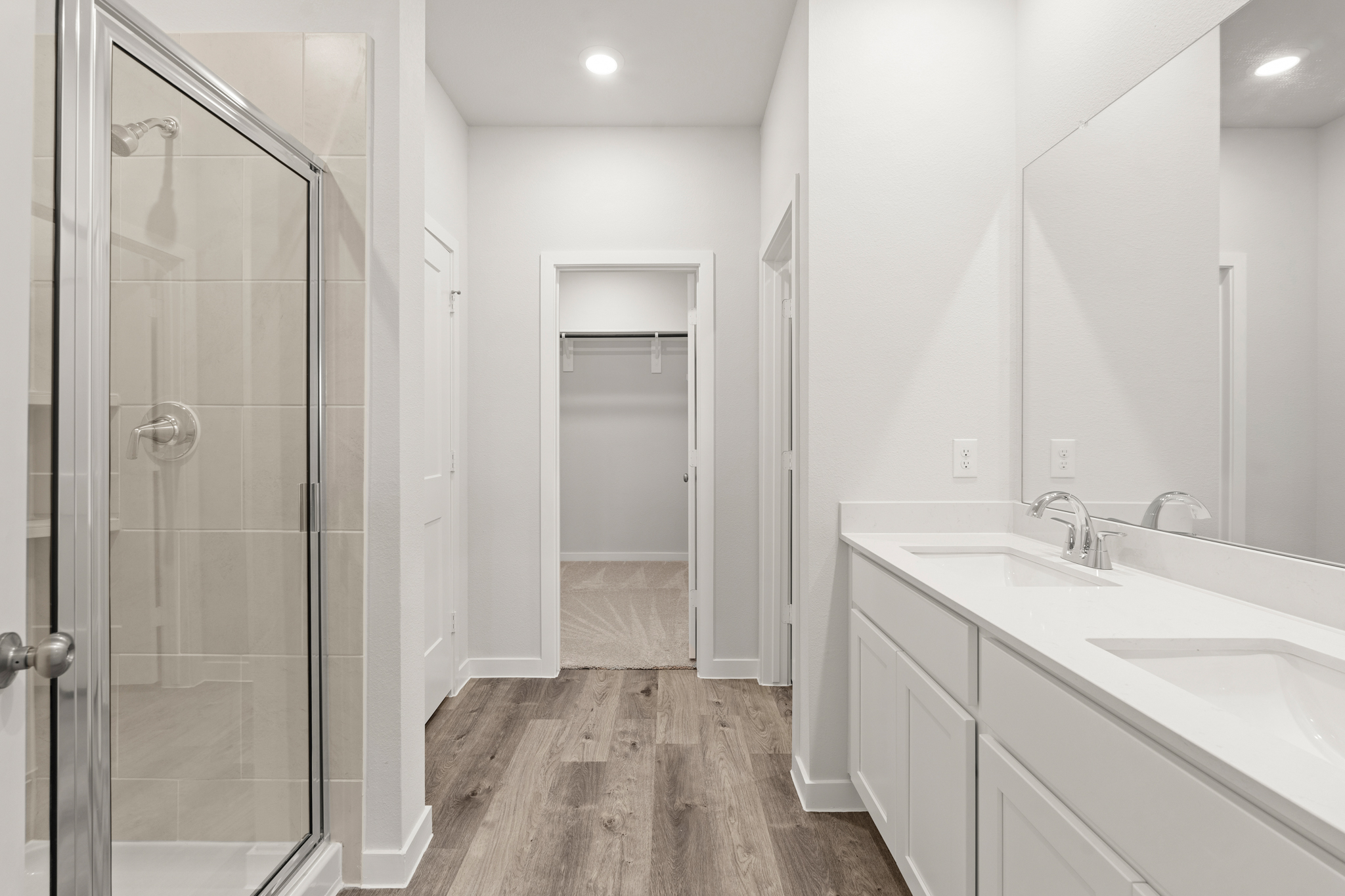 A bathroom with a glass shower.