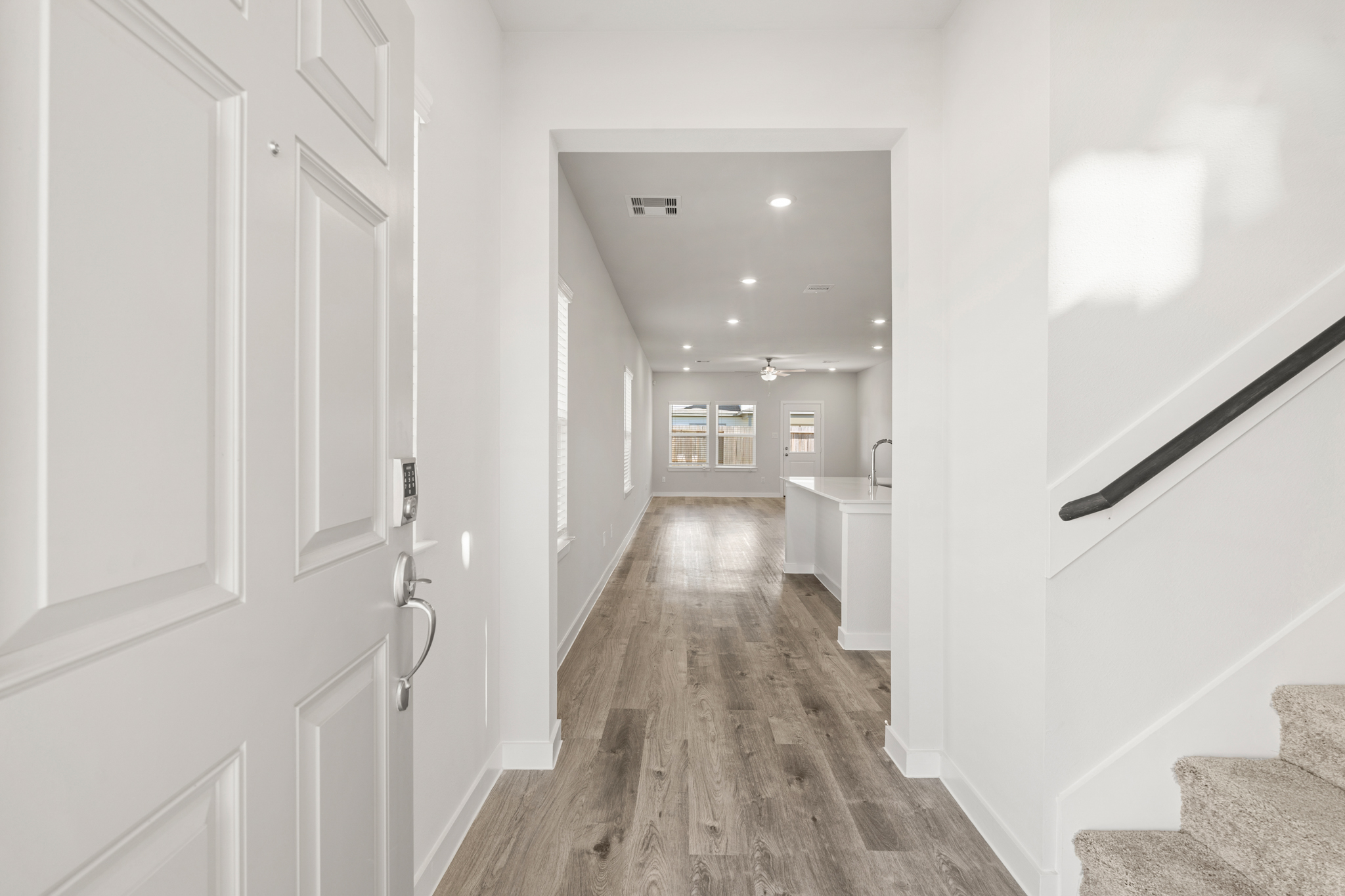 A hallway with white doors.