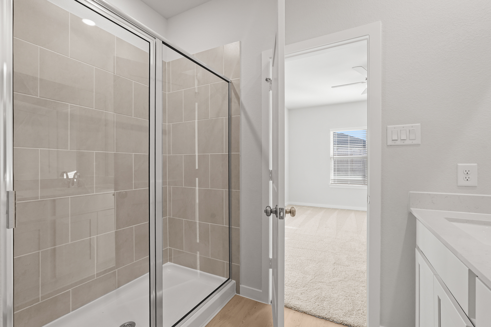 A bathroom with a glass shower.