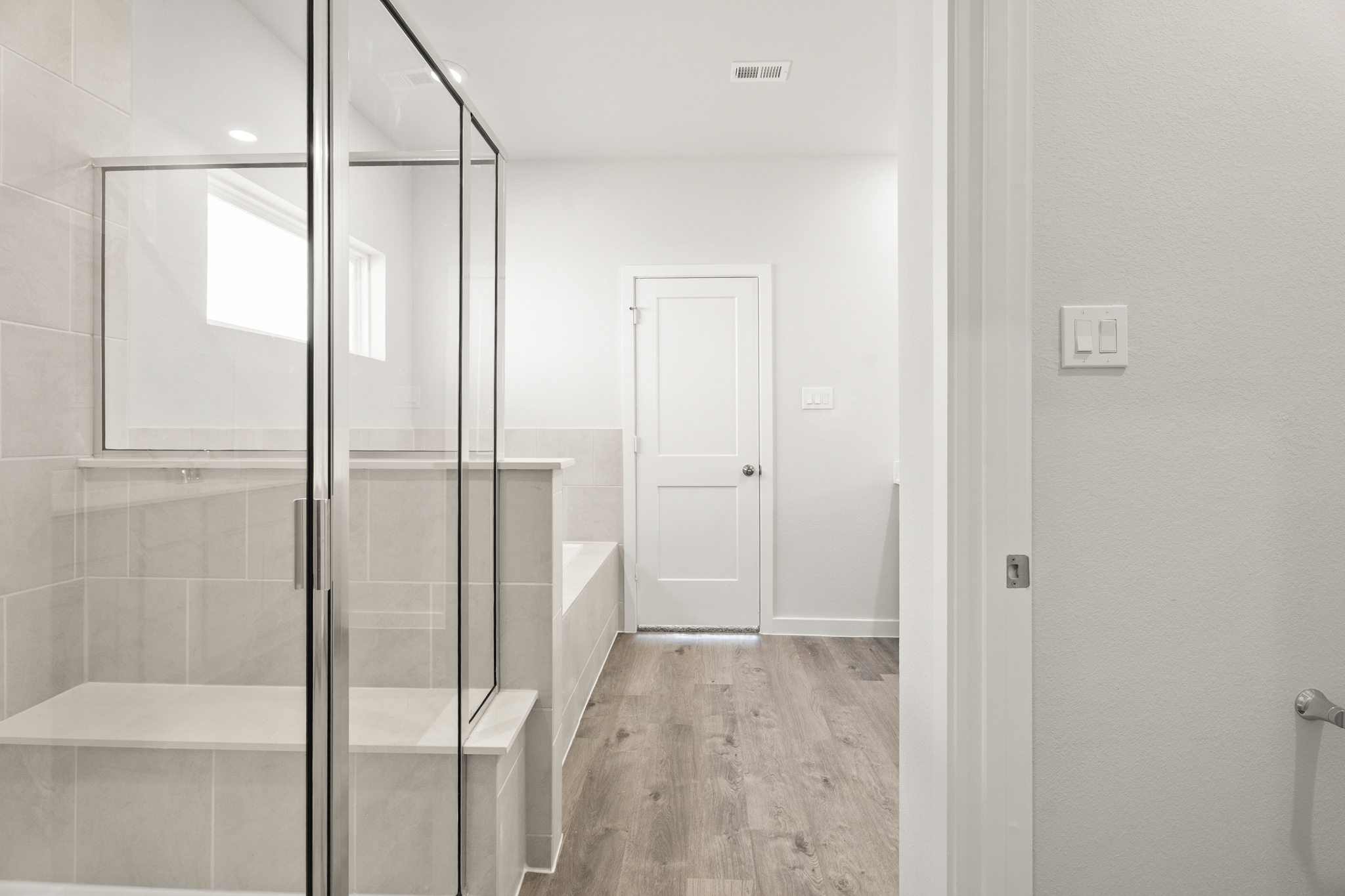 A bathroom with a glass shower.