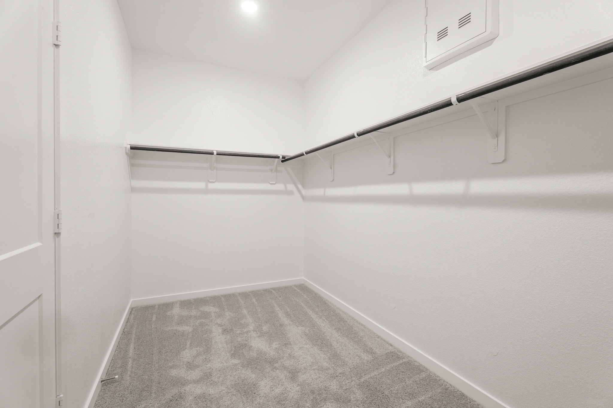 A hallway with white walls.