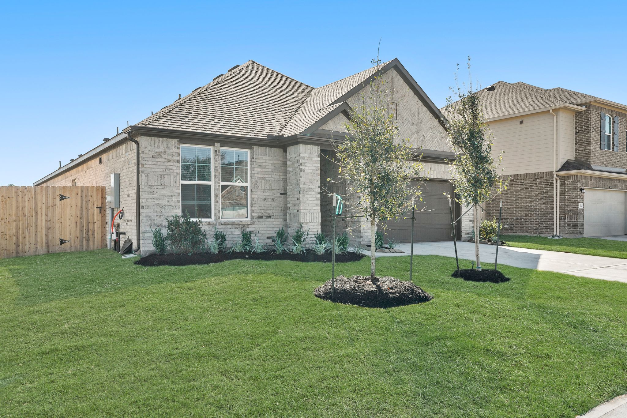 A house with a yard and trees.