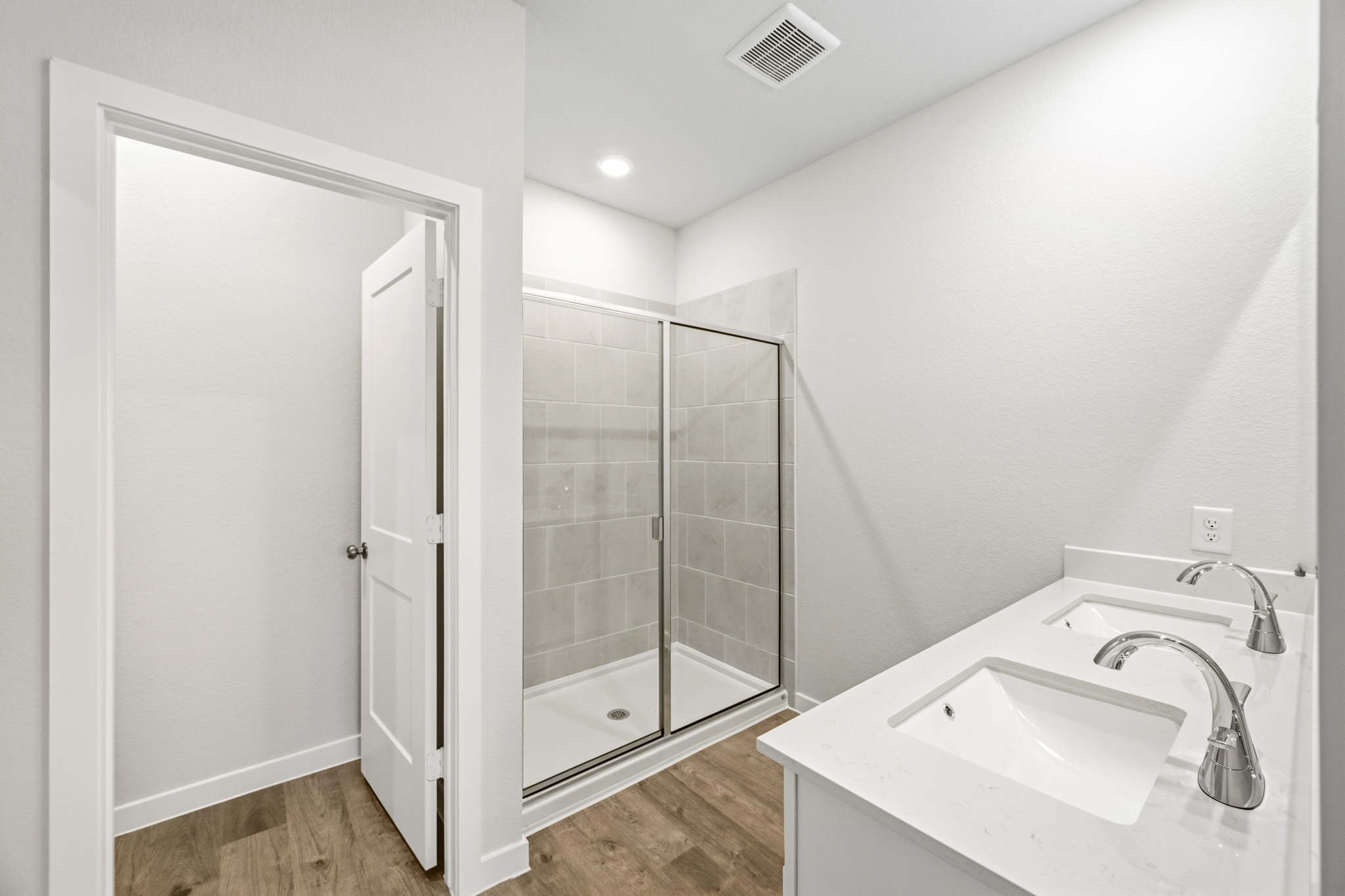 A bathroom with a glass shower.