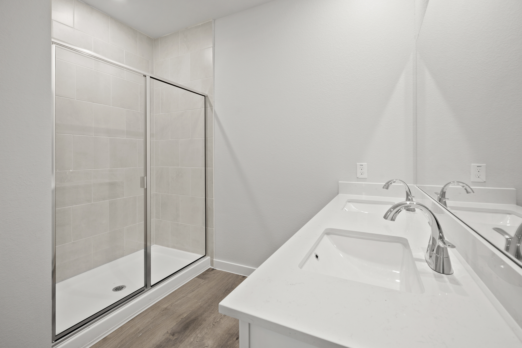 A bathroom with a glass shower.