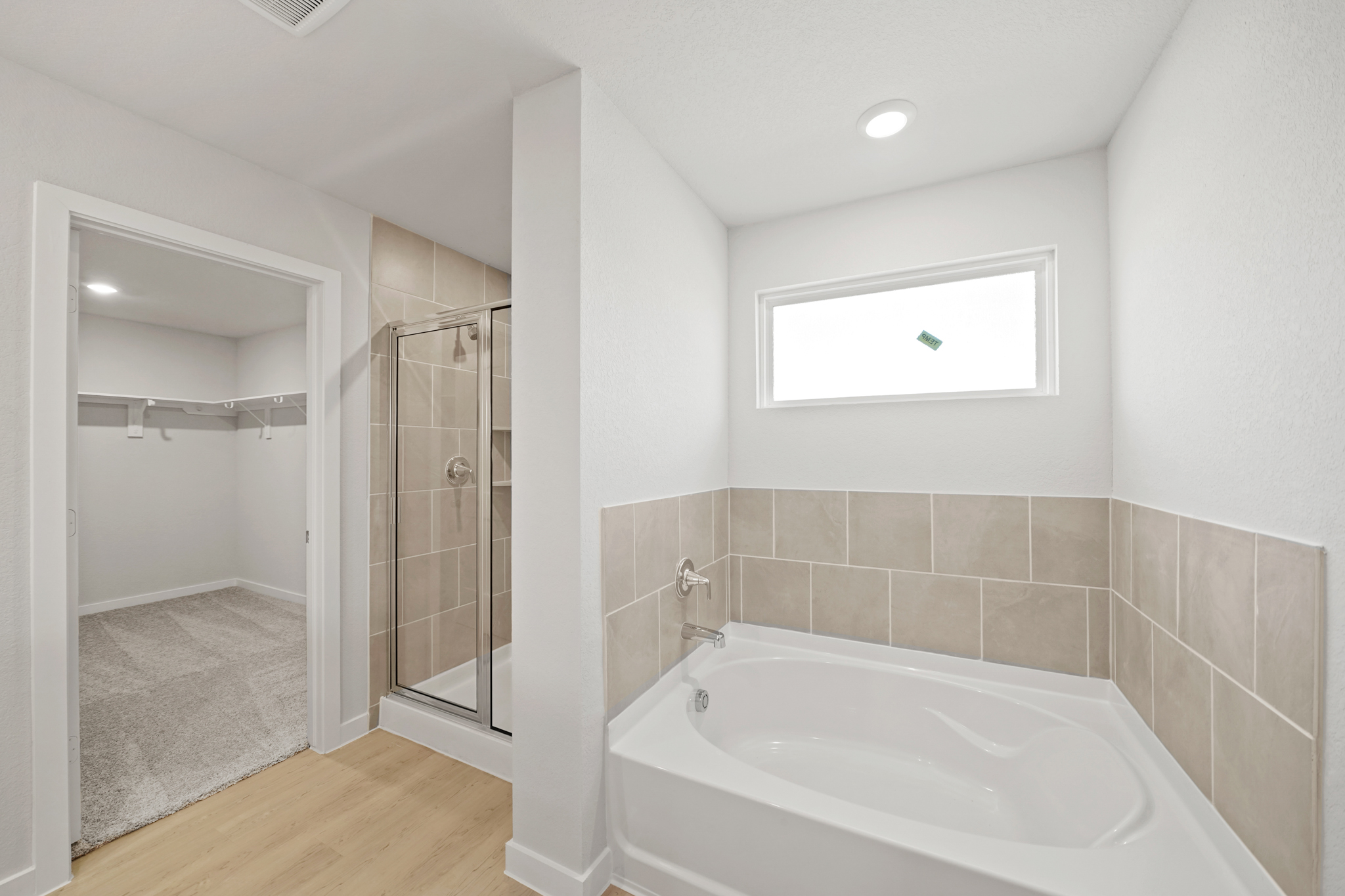 A bathroom with a glass shower.