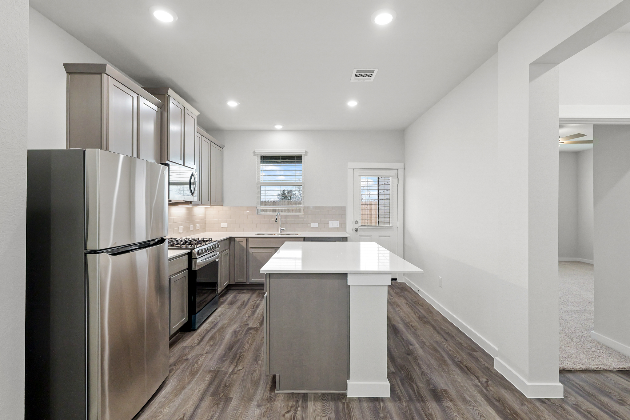 A kitchen with a large island.