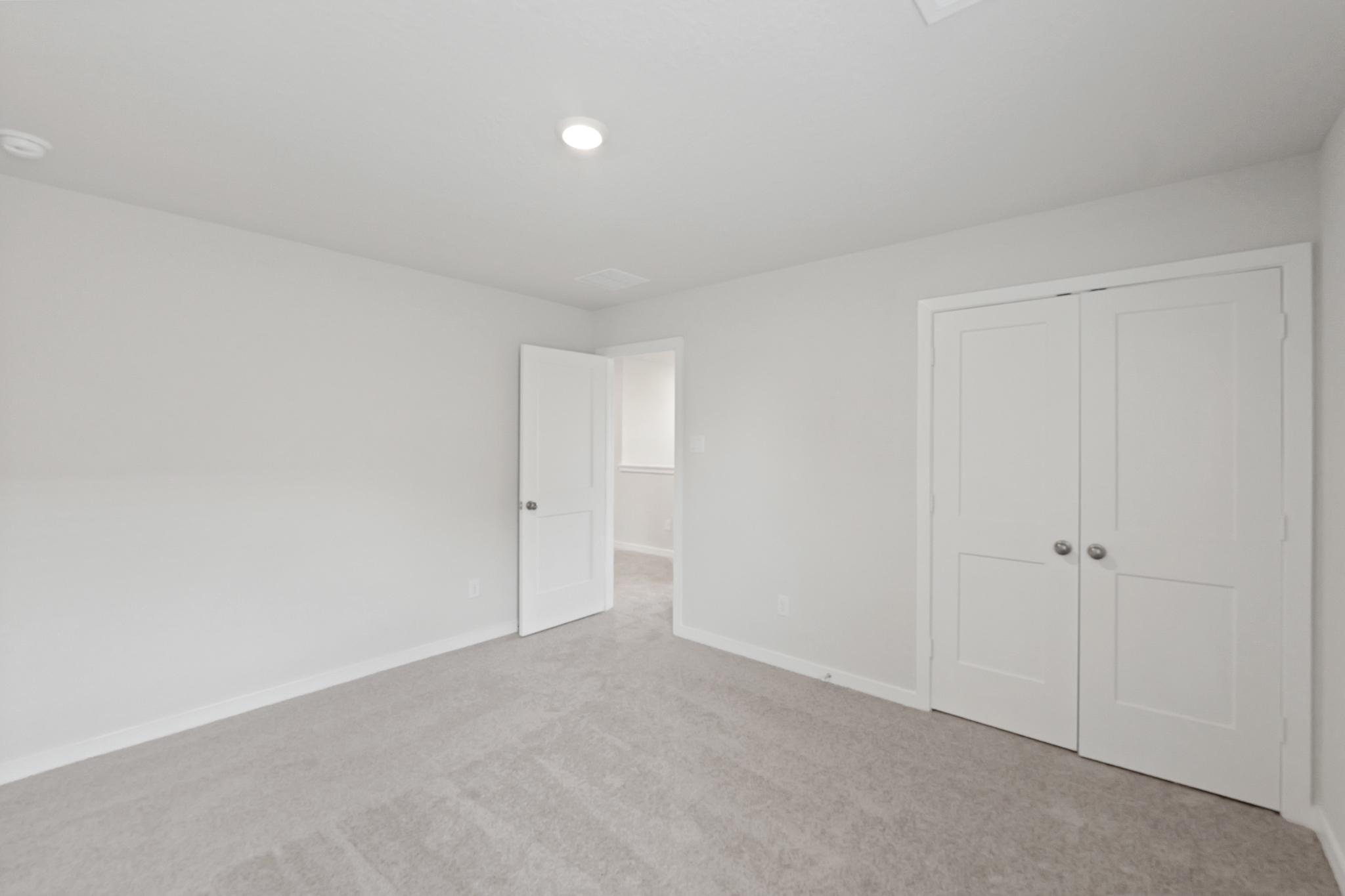 A room with white doors.