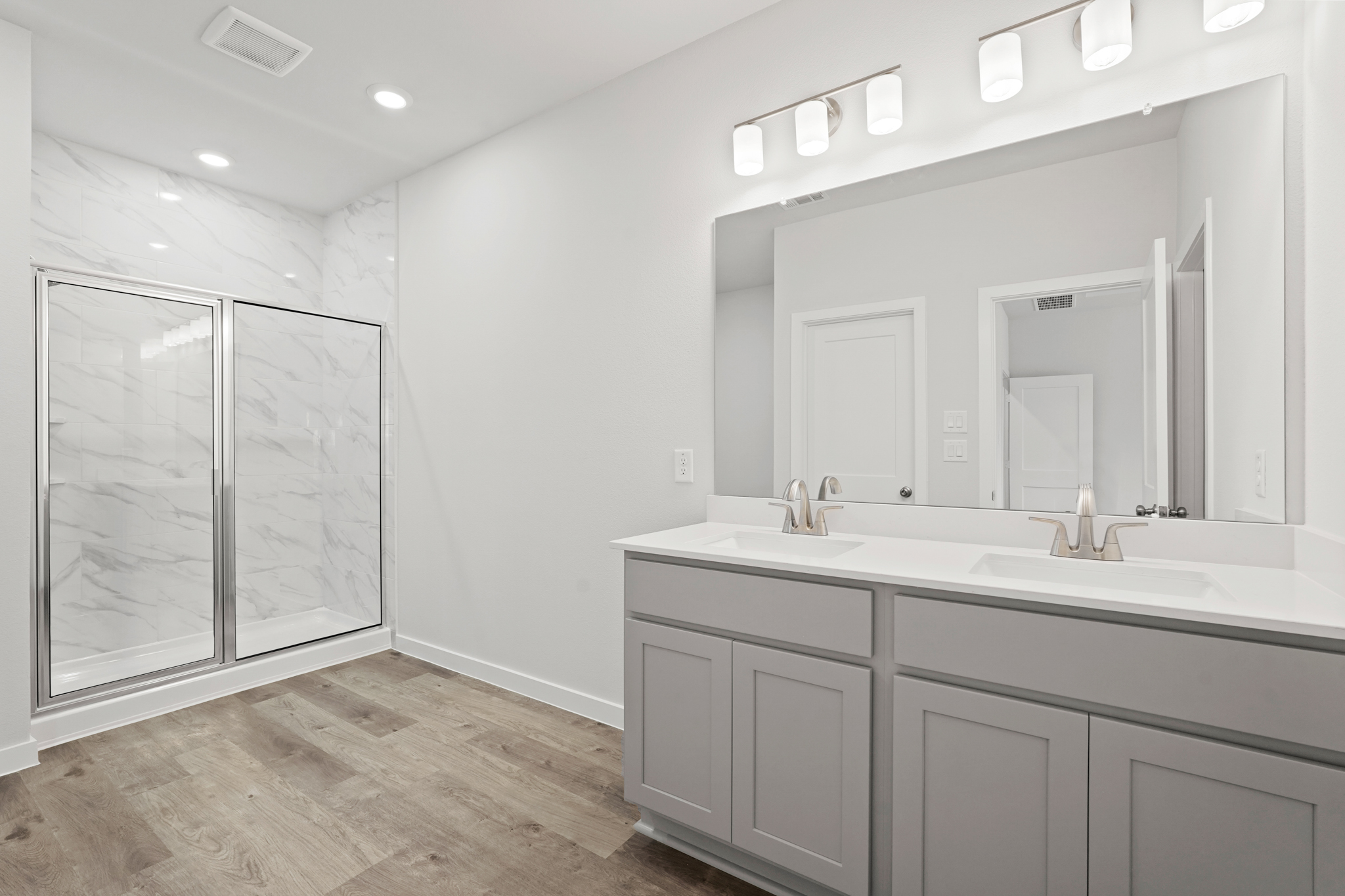 A bathroom with a glass shower.
