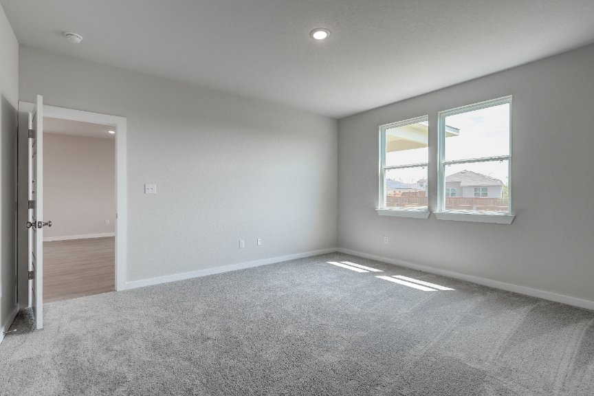 A room with a window and a door.