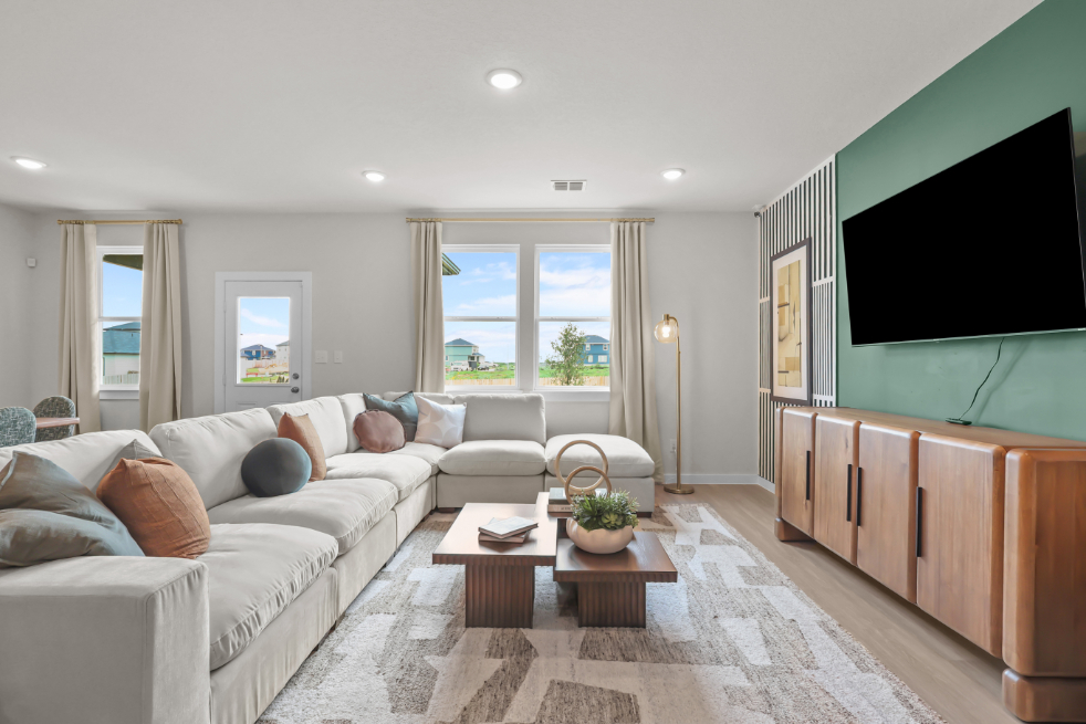 A living room with a tv and couches.