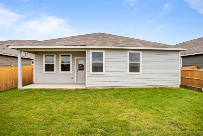 A house with a grass yard.