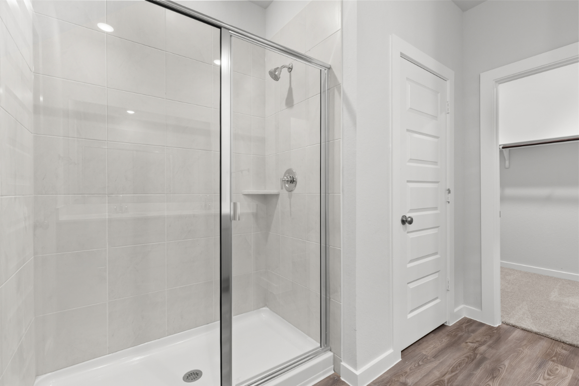 A bathroom with a glass shower.
