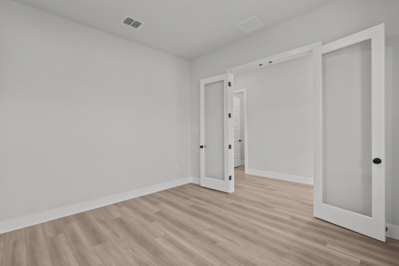 A room with white doors.