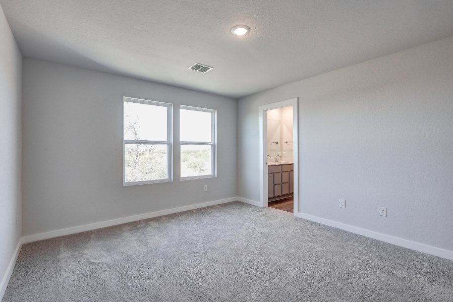 A room with a window and a door.