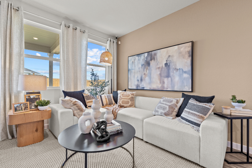 A living room with a couch and coffee table.