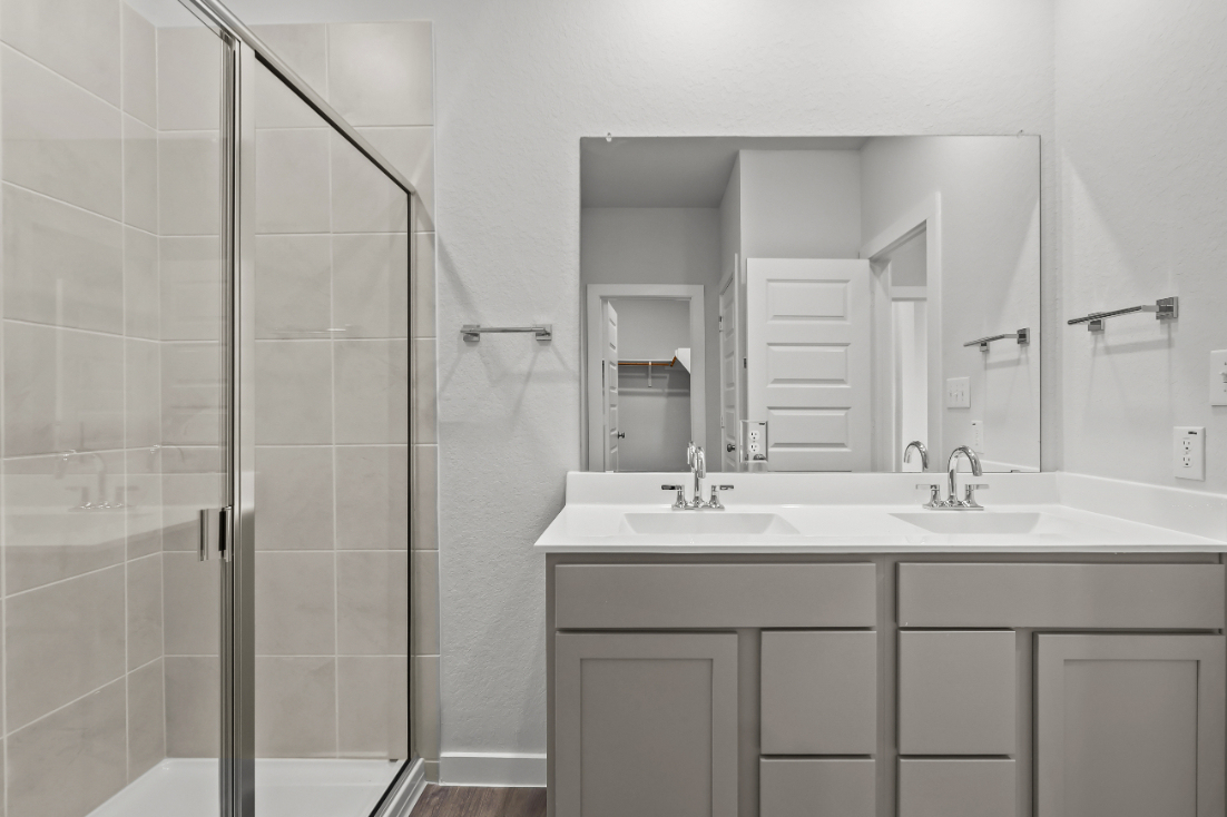 A bathroom with a glass shower.
