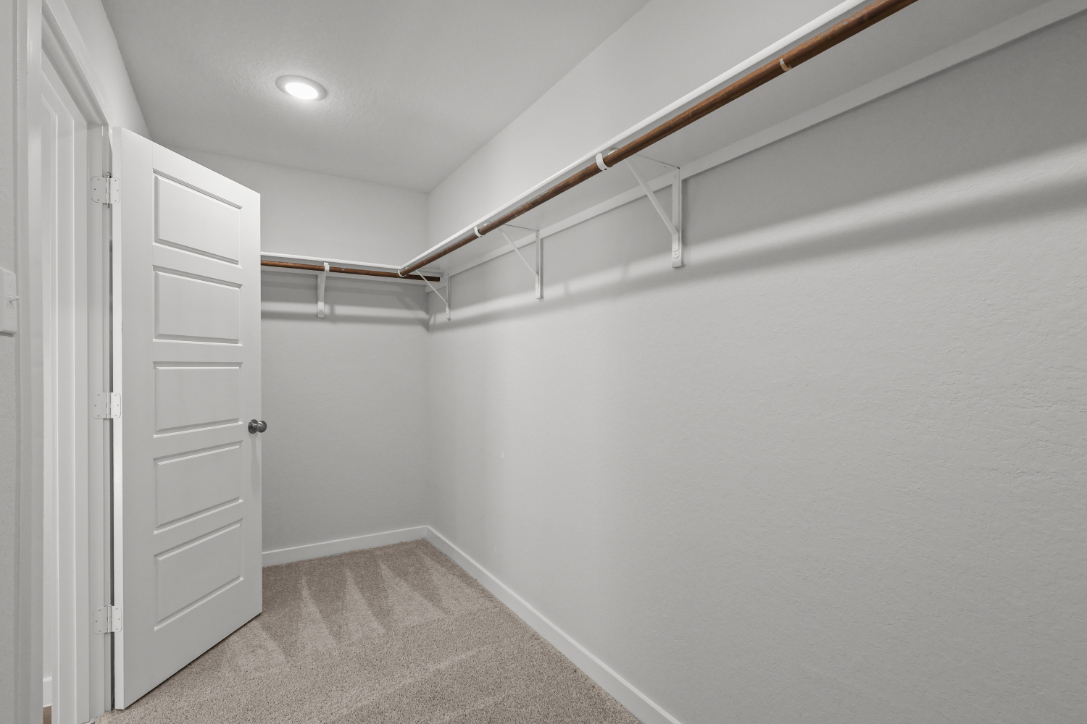 A hallway with white walls.