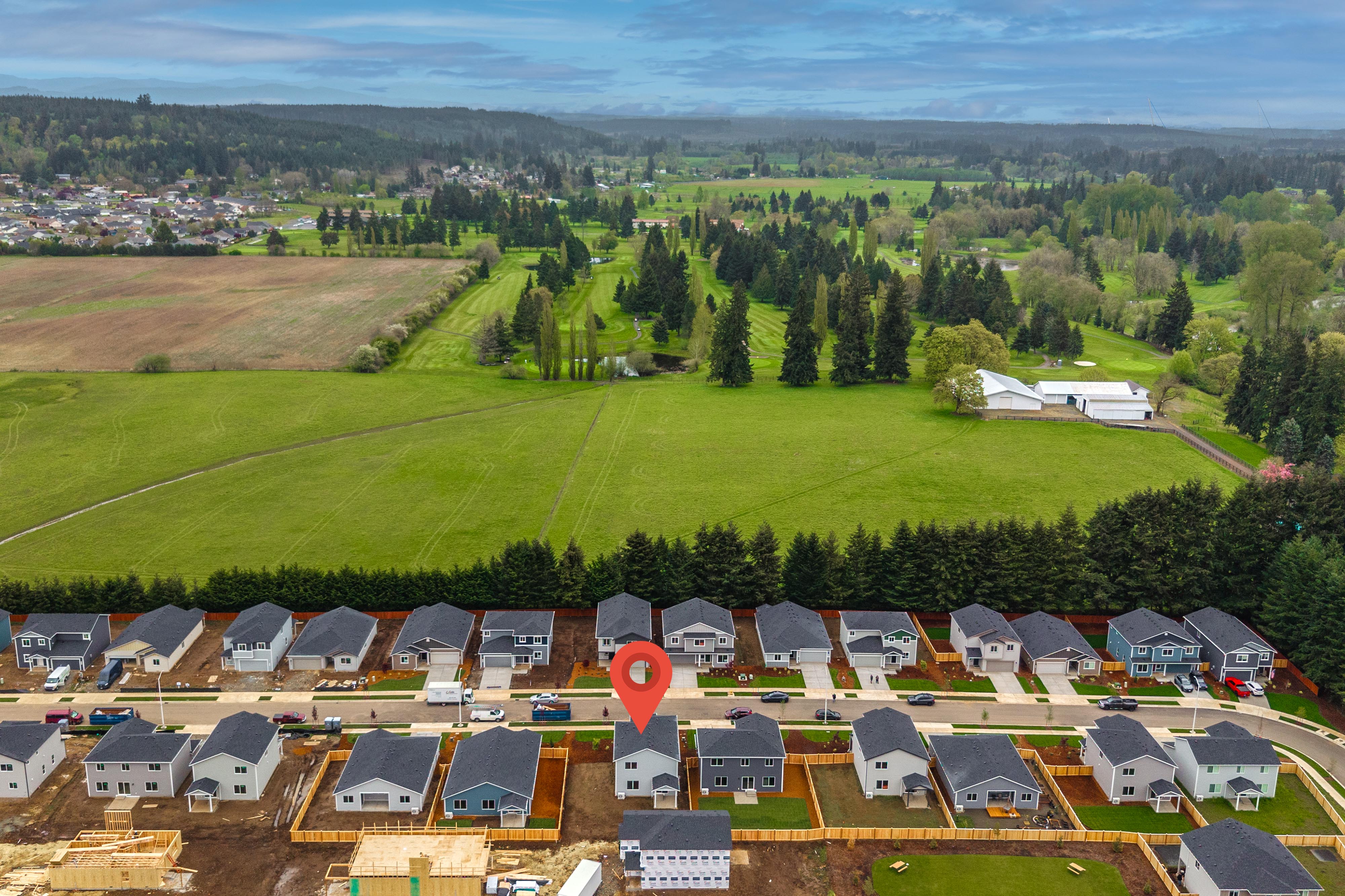 A group of houses in a field.