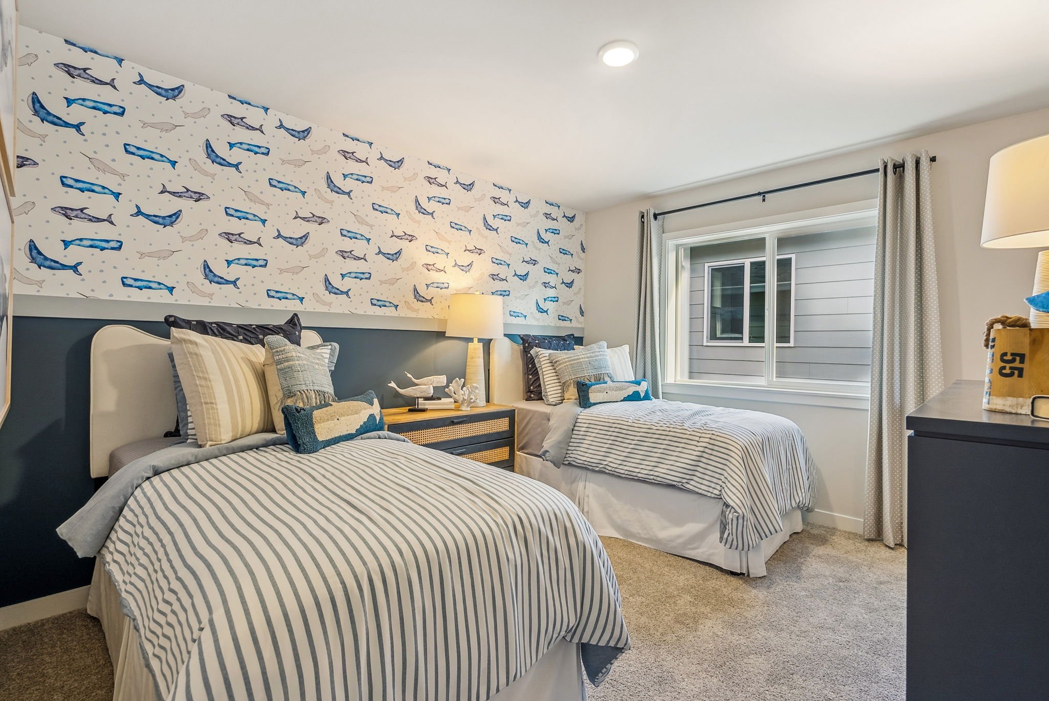 A bedroom with two beds.