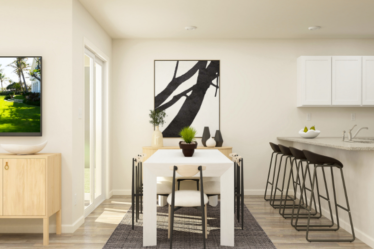 A kitchen with a table and chairs.