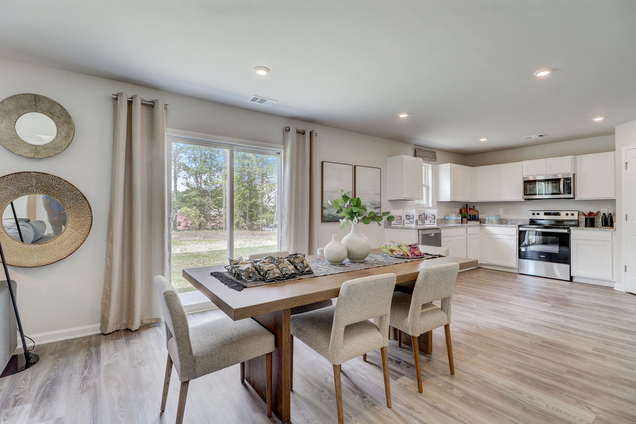 A kitchen with a dining table.