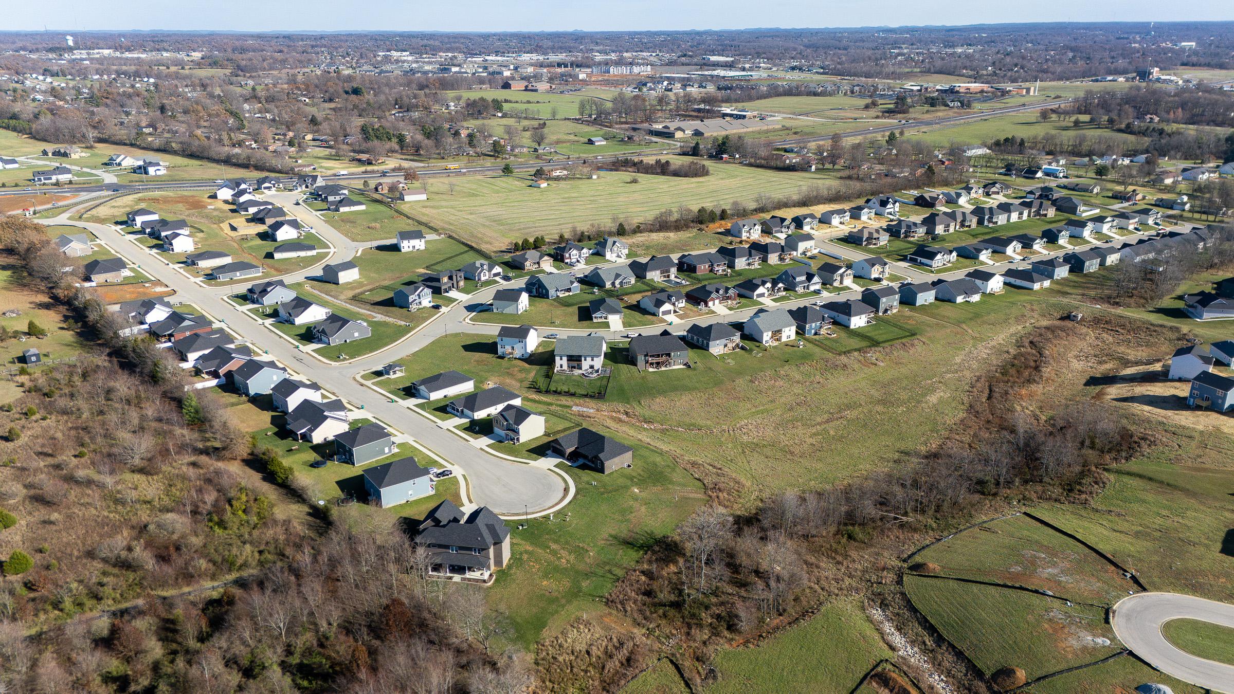 A group of houses in a field.