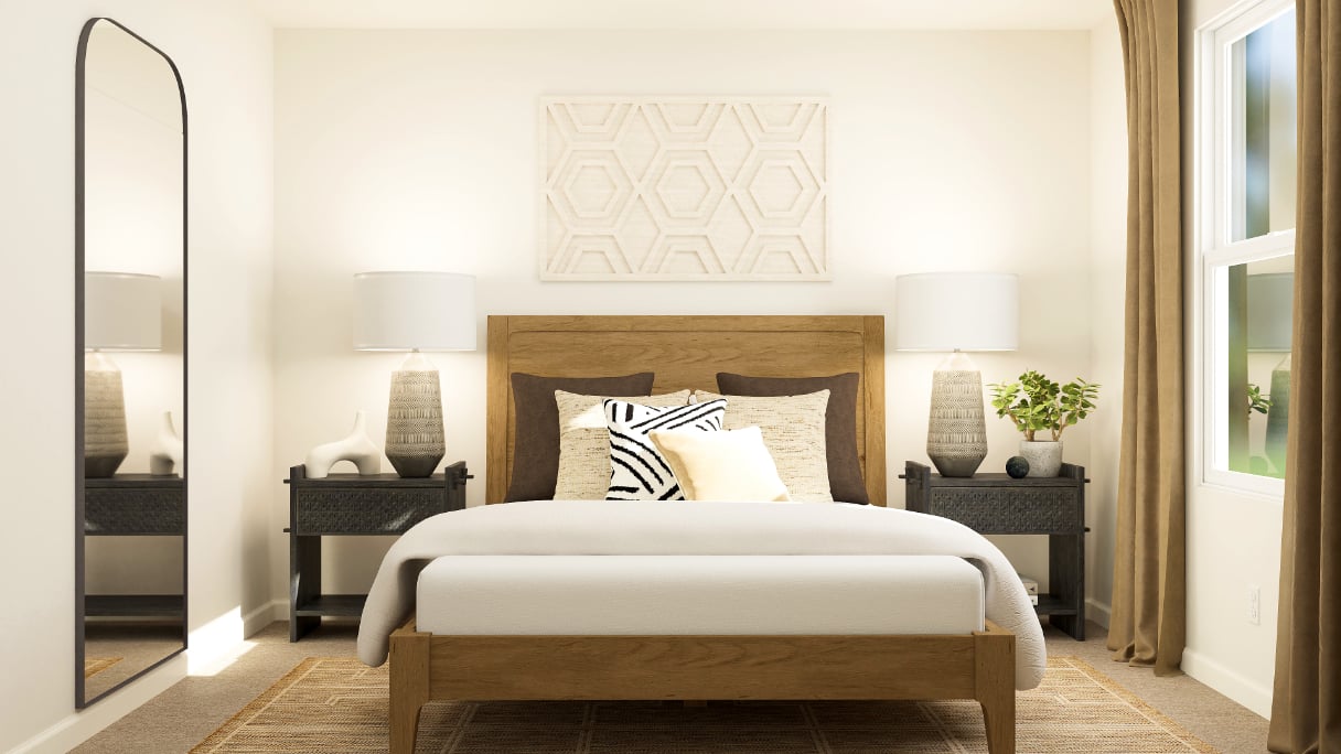 A bed with lamps on either side.