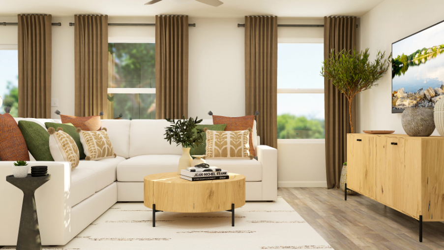 A living room with a white couch and a coffee table.