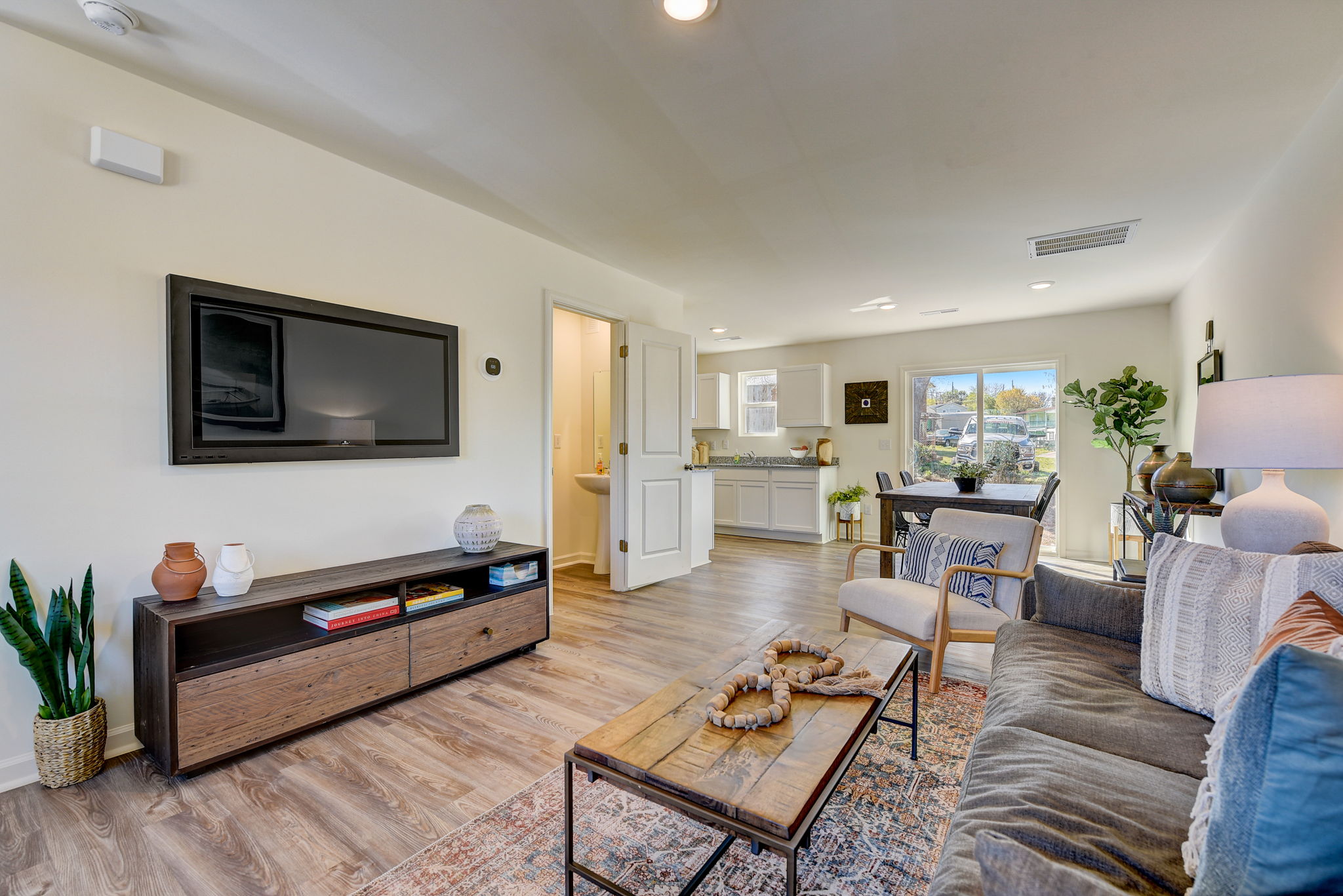 A living room with a tv and couches.