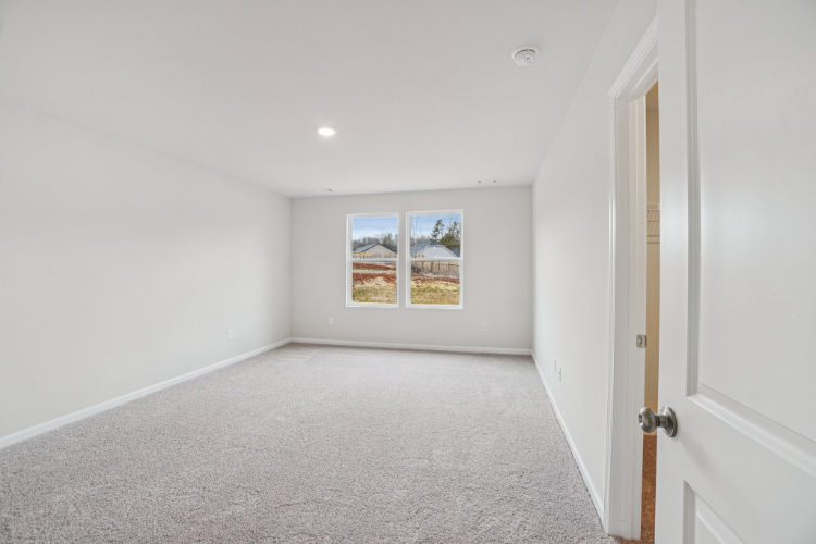 A hallway with white walls.